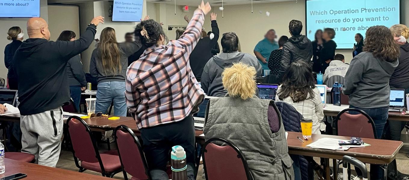 Health educators and counselors engage in a “snowball fight” where crumpled up papers with questions that need answers are shared throughout the classroom.