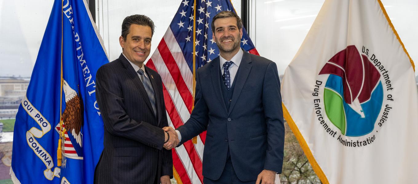 men in blue suits shaking hands