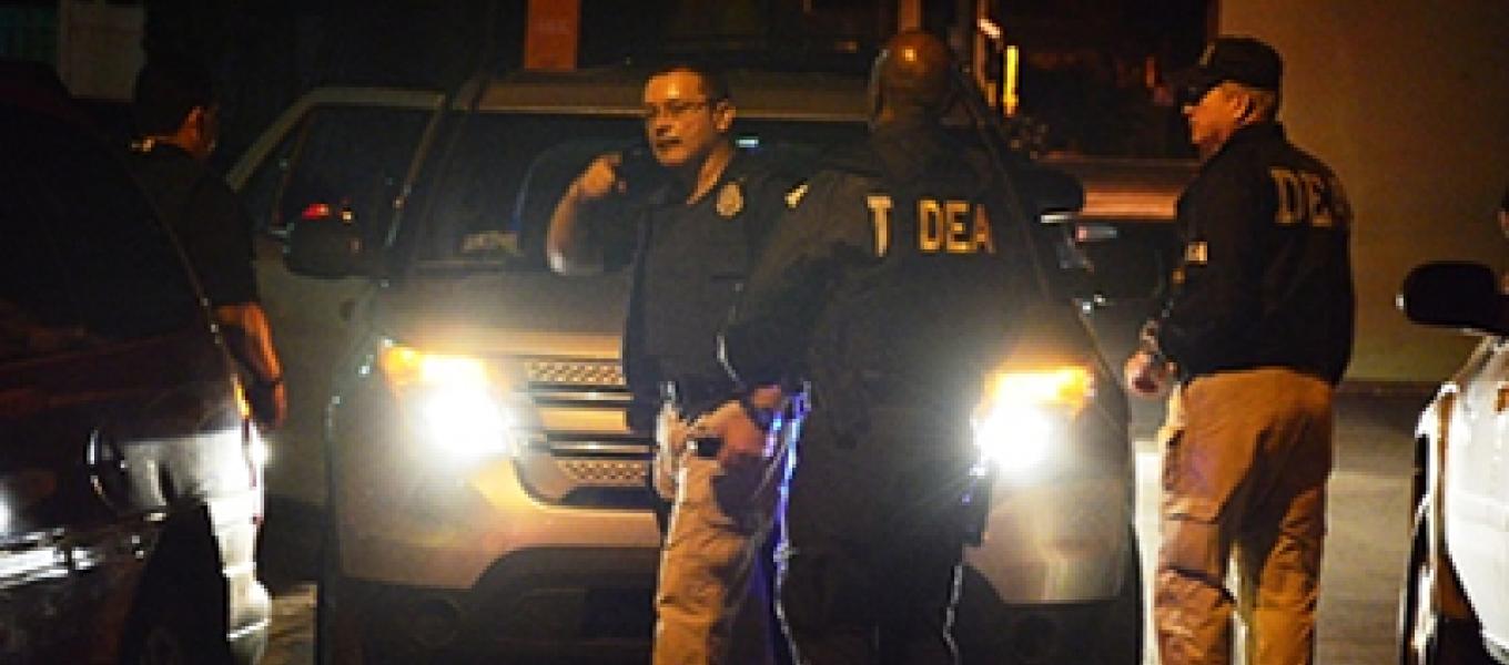 PRPD-DEA Task Force Lieutenant Ruben Lorenzo briefs DEA supervisors on the progress of the arrest operation. 