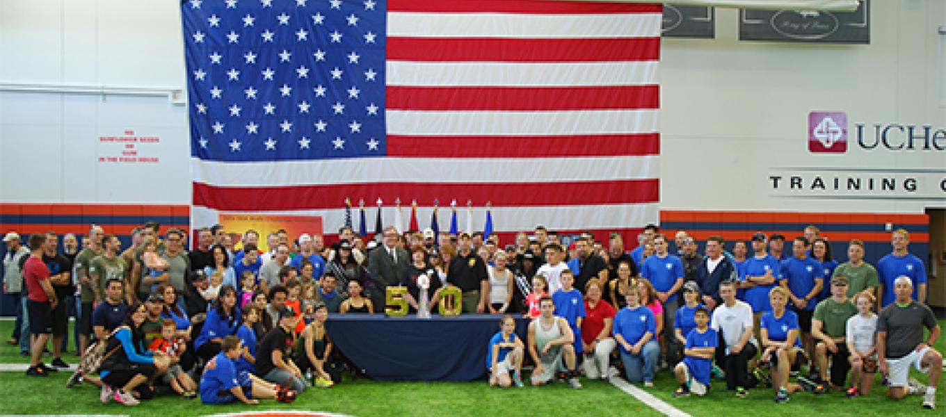 Participants at the new Denver Broncos practice facility with the Lombardi Trophy.