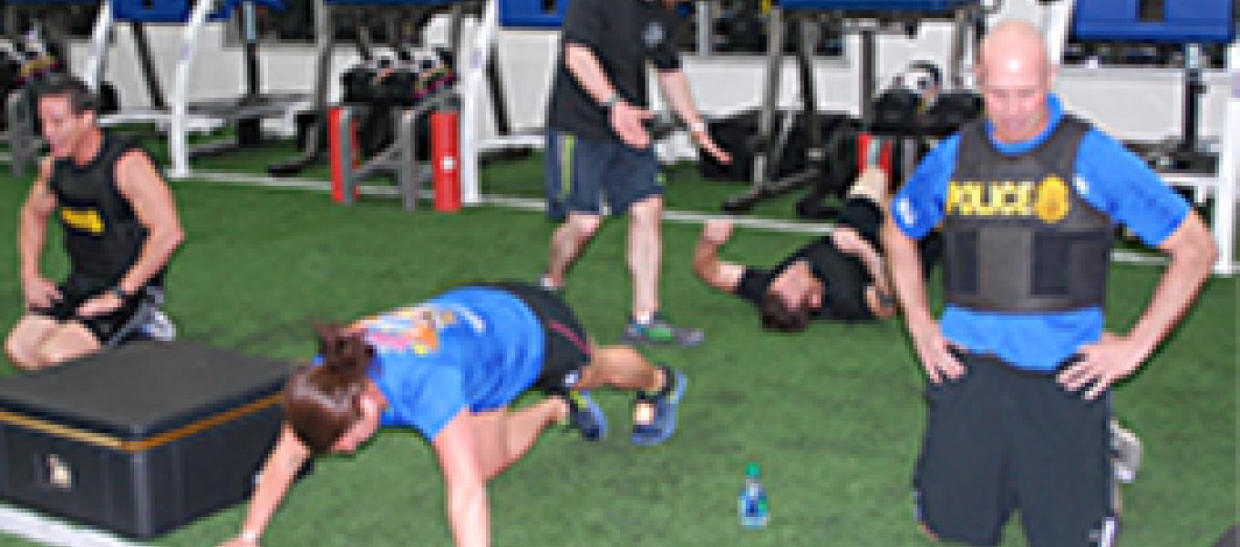 Special Agent Keith Billiot, USAF Capt. Dana Lyon (wife of 2015 honoree David Lyon), and special agent Gregory participating in one of many physical challenges.