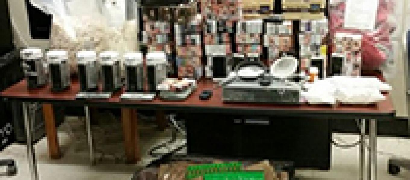 Seized heroin, drug paraphernalia and equipment used at the heroin mill to process and package heroin.