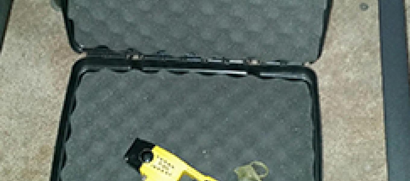 Taser and hand grenade retrieved from an apartment.