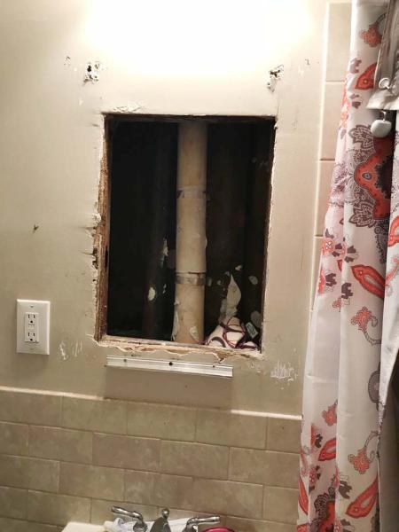 Concealed space behind medicine cabinet.