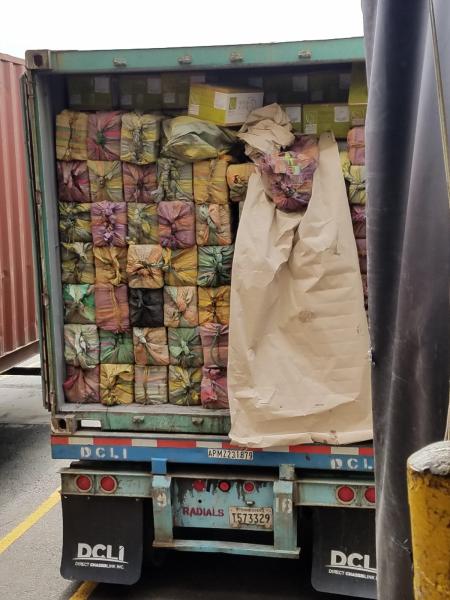 Bundles filled with cocaine concealed within container