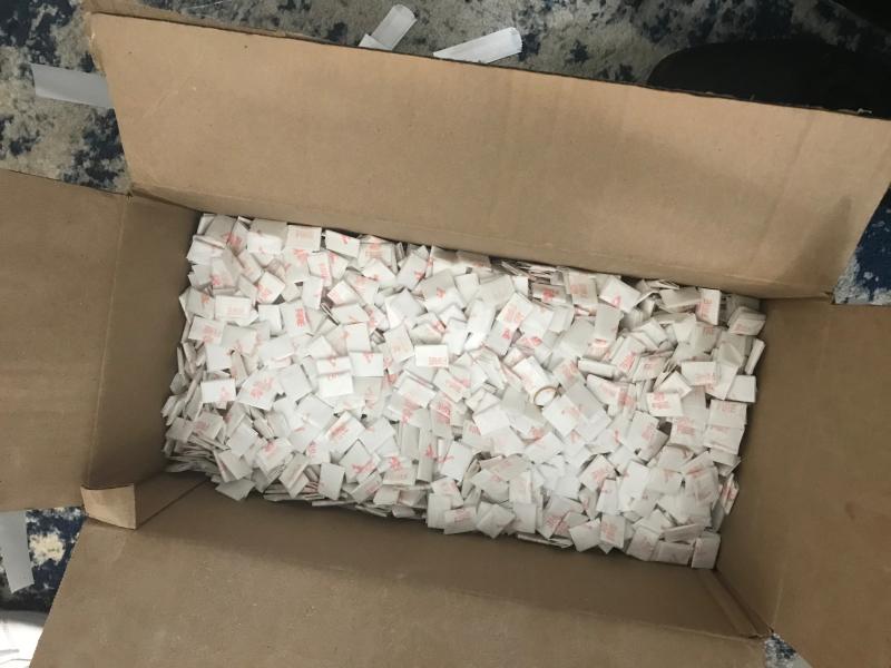 Close up of "fire" branded heroin and fentanyl glassine