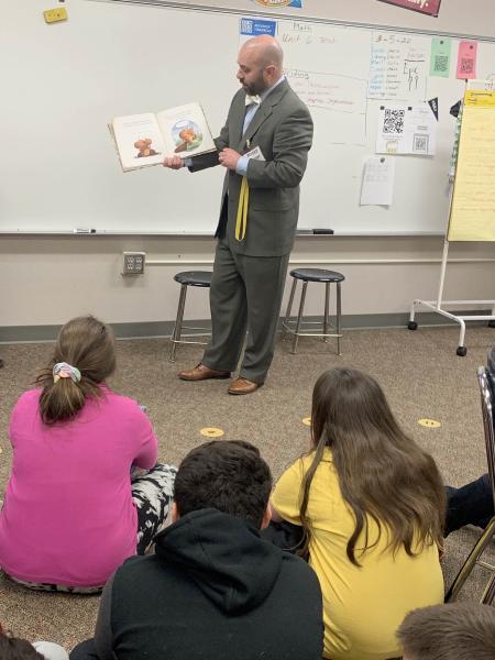 DEA staff reading to students.