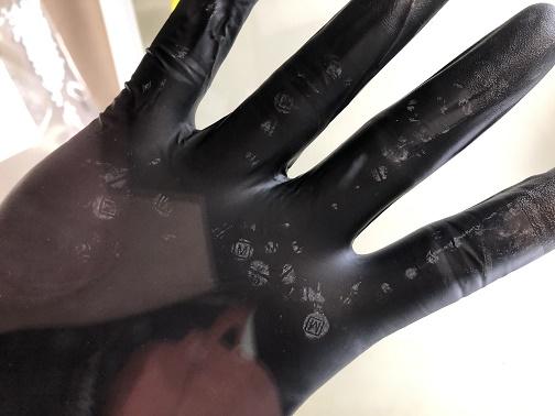 Handling of fentanyl pills can be dangerous, as depicted on this glove