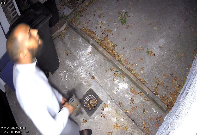 Defendant looks at police vehicle