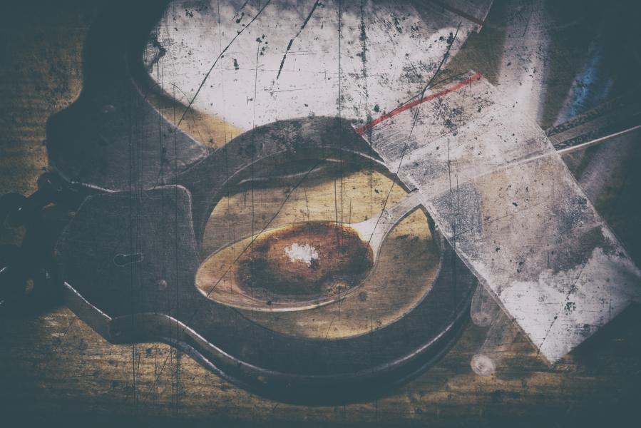 cuffs, heroin, and baggies of drugs