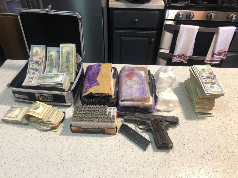 Seized drugs, cash and gun