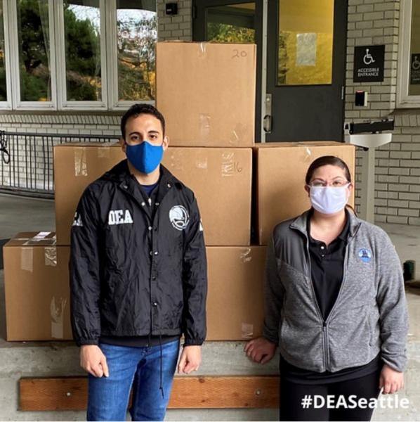 DEA and Mercer Island Police with 9 boxes of collected prescription drugs