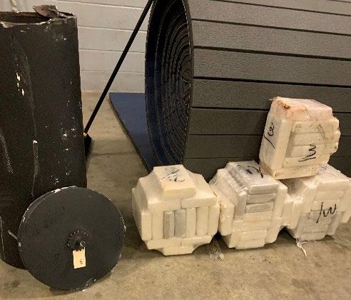 close up of cocaine kilograms removed from lawn roller container