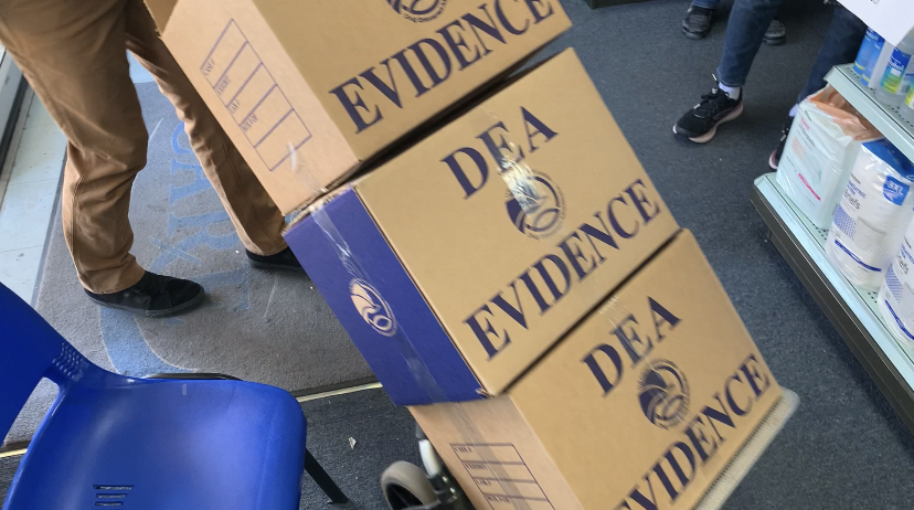 Evidence Boxes of Thousands of Dosage Units of Narcotics Being Removed from Pharmacy