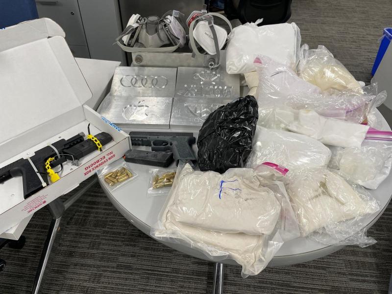 guns, drugs, drug packaging paraphernalia seized