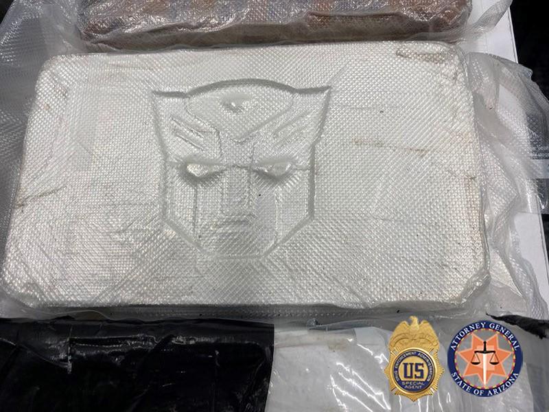 Photo of One Kilogram of Fentanyl Powder Stamped with Transformer Logo.