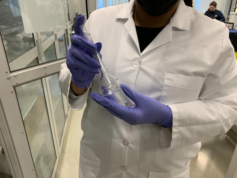 scientist testing nitazene in a beaker