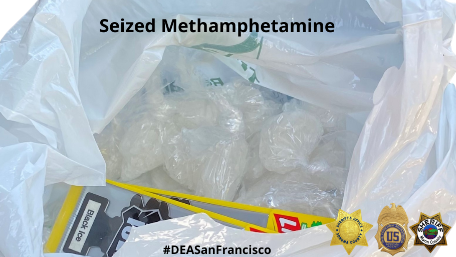 Methamphetamine wrapped in clear plastic wrap contained in a white plastic shopping bag