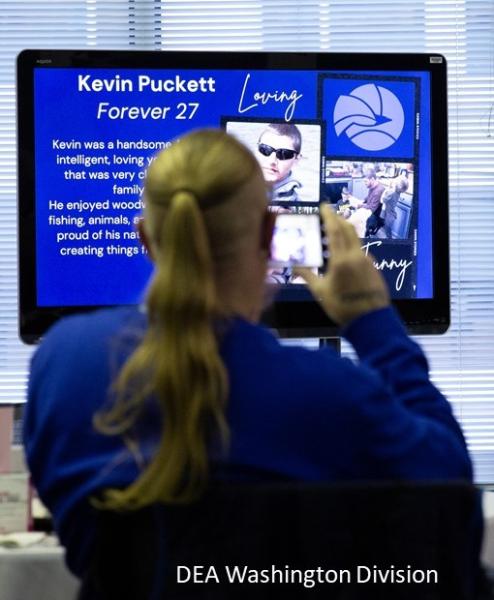 Participant watching a a tribute video with loved ones lost to the Fentanyl Poisoning Crisis.