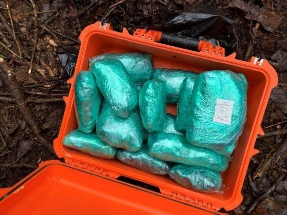 Drugs hidden in buried cooler