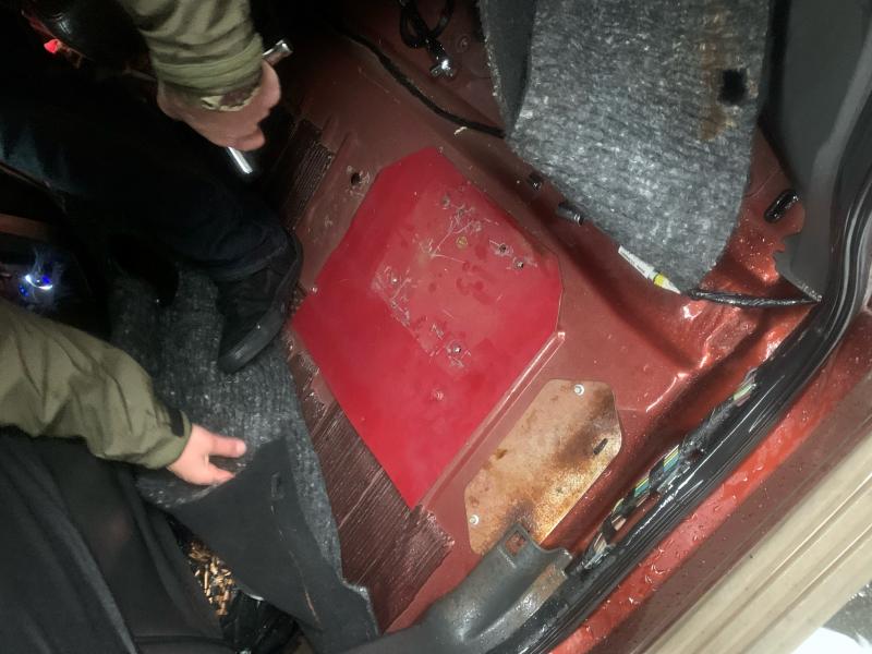 gas tank covered on vehicle's floorboard