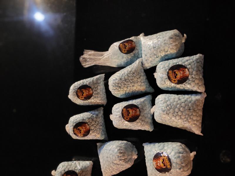 Bags of Fentanyl Pills labeled with Chester Cheetos Markings
