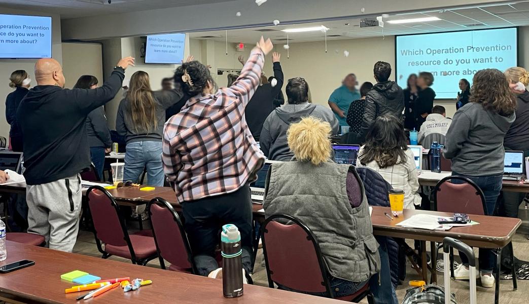 Health educators and counselors engage in a “snowball fight” where crumpled up papers with questions that need answers are shared throughout the classroom.