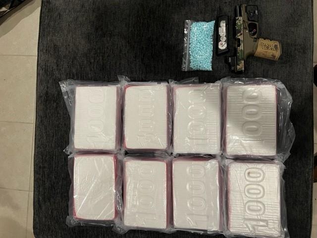 Drugs and handgun seized.