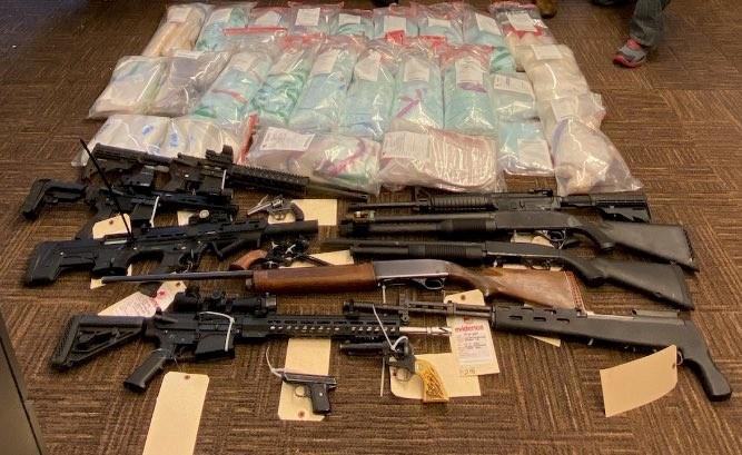 Seized firearms and fentanyl.