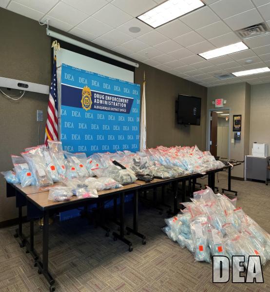 Drugs displayed on a table in a conference room