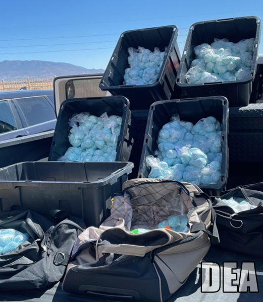 Fentanyl pills in storage containers in the back of a truck