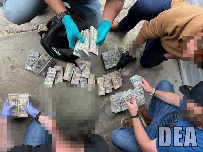 Agents counting cash on the ground