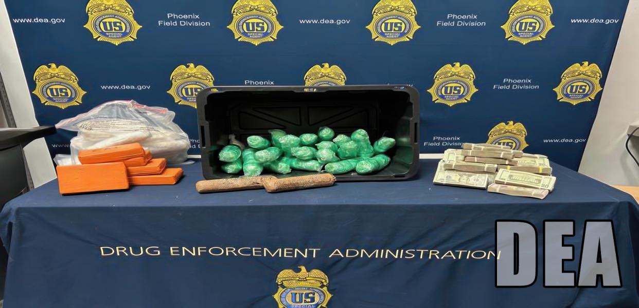 drugs and cash displayed on a table