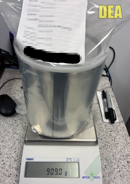 Liquid fentanyl seized by law enforcement during Operation Knoxville Thunder is shown on a digital scale.