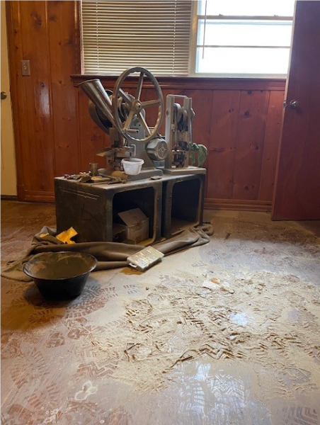 pill press sits on a floor