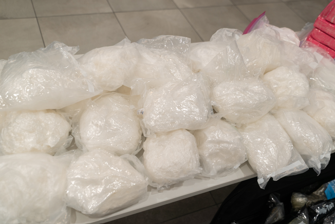 Photos of drugs (cocaine and methamphetamine) seized during the residential search