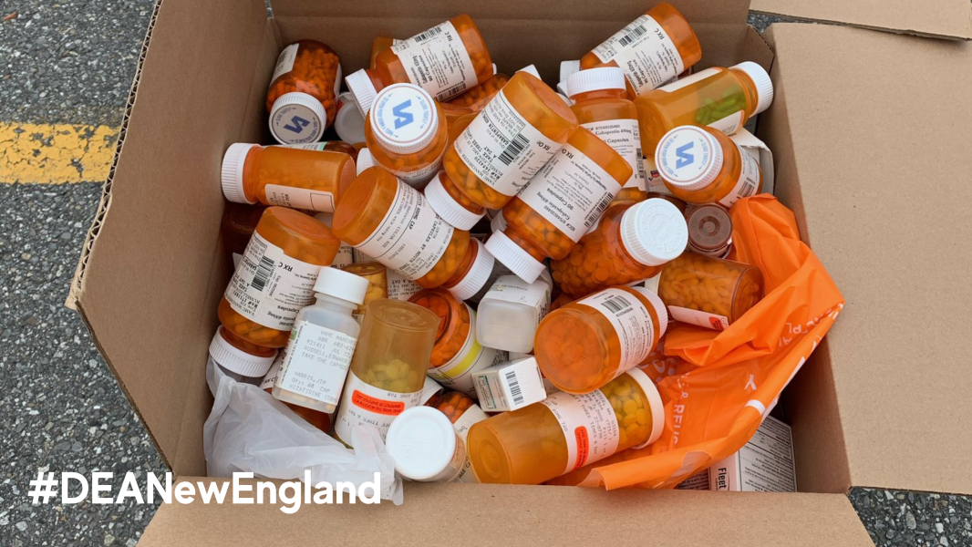 Prescription medication bottles fill a bag at a Drug Take Back location in New England