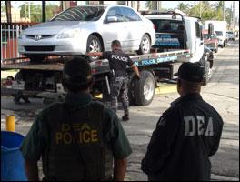DEA, ATF and PRPD agents seize a vehicle as part of the arrest operation conducted at the Manuel A. Perez Public Housing Project in San Juan, P.R. 