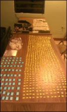 Crack-Cocaine, cocaine, paraphernalia , weapons, and cash seized from the defendants. 