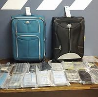Suitcases and cocaine seized at the Luis Munoz Marin International Airport.