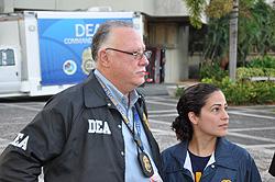 SAC Javier Peña and USPIS Supervisor Delany De Leon answer questions from the media
