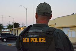 DEA Special Agent provides perimeter security during arrest operation at La Ceiba Public Housing Project in Ponce, Puerto Rico