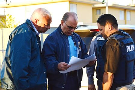 DEA Special Agent provides perimeter security during arrest operation at La Ceiba Public Housing Project in Ponce, Puerto Rico