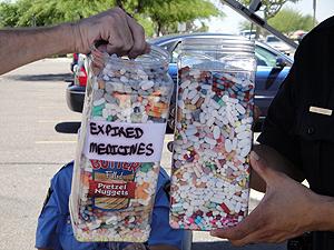 Two full candy containers with various types of medications collected in Arizona