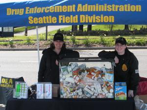 Drive-up collection site in West Seattle with drugs collected from three cars.