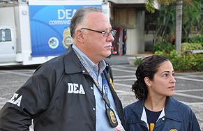 SAC Javier Peña and USPIS Supervisor Delany De Leon answer questions from the media. 