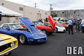 Auction patrons get a preview of vehicles before auction starts.