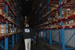 DEA Investigators reviewing inventory in the distribution center.