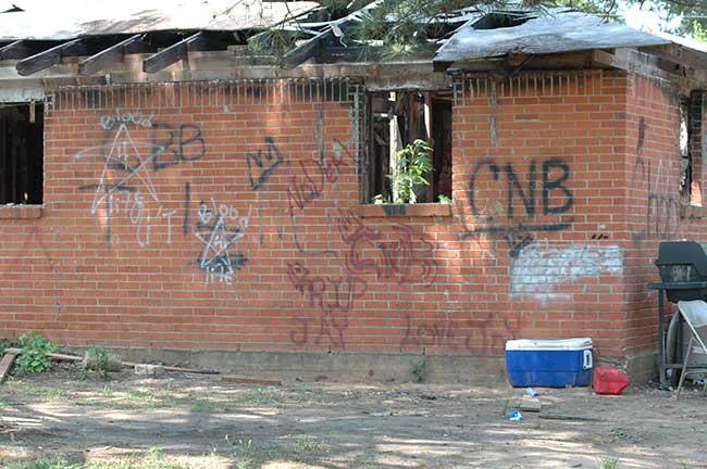 An area in Crenshaw Village in Elmore County, Alabama where the “Care Nothin’ ‘Bout It” Gang (CNB) marked the buildings with graffiti.
