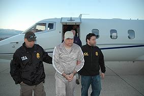 DEA agents escort Esteban Rodriguez-Olivera upon his arrival in the U.S.